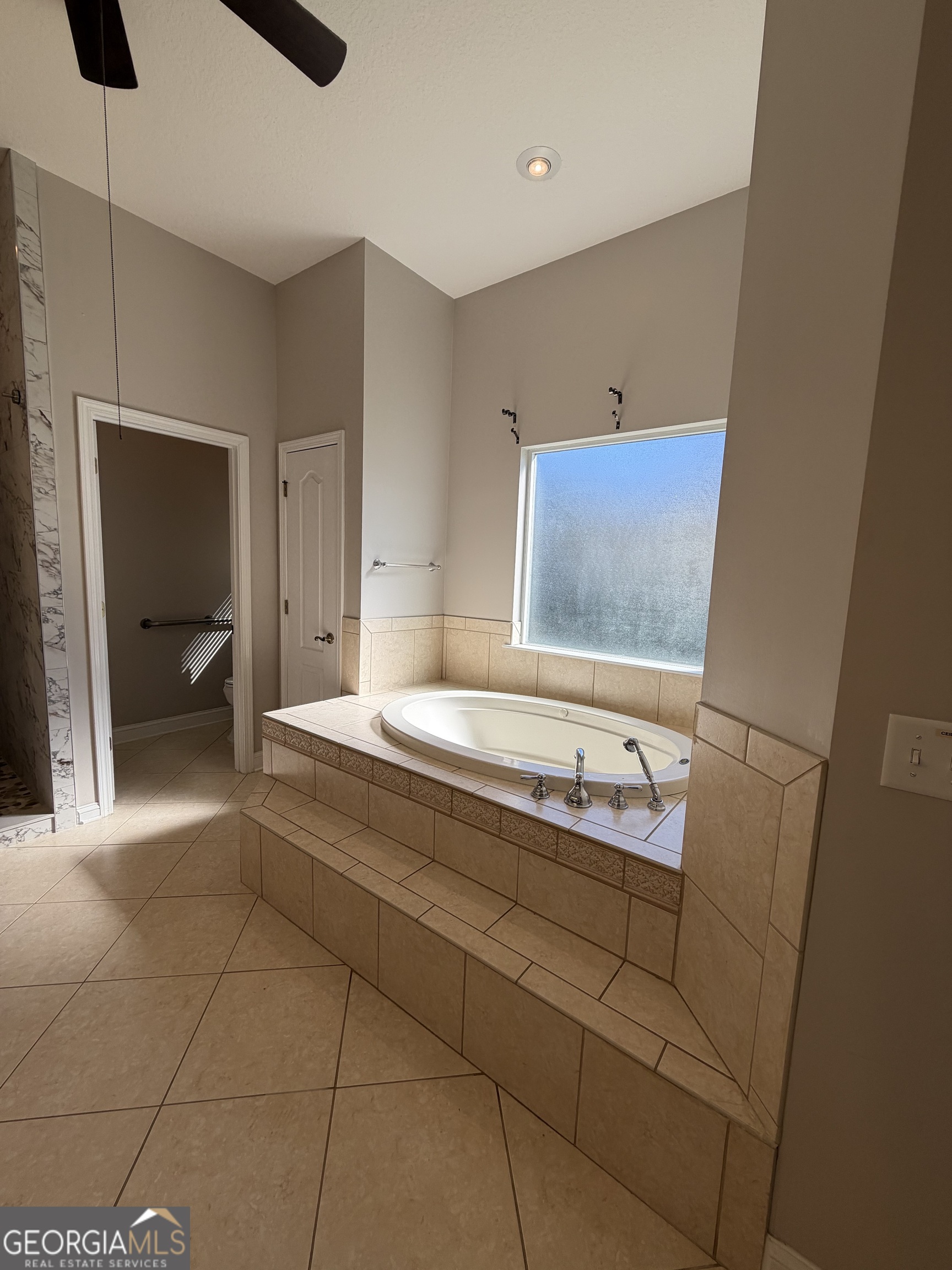 108 Heron's Nest Circle Kingsland, GA 31548 - Photo 36 of 62 a bathroom with a sink and a mirror