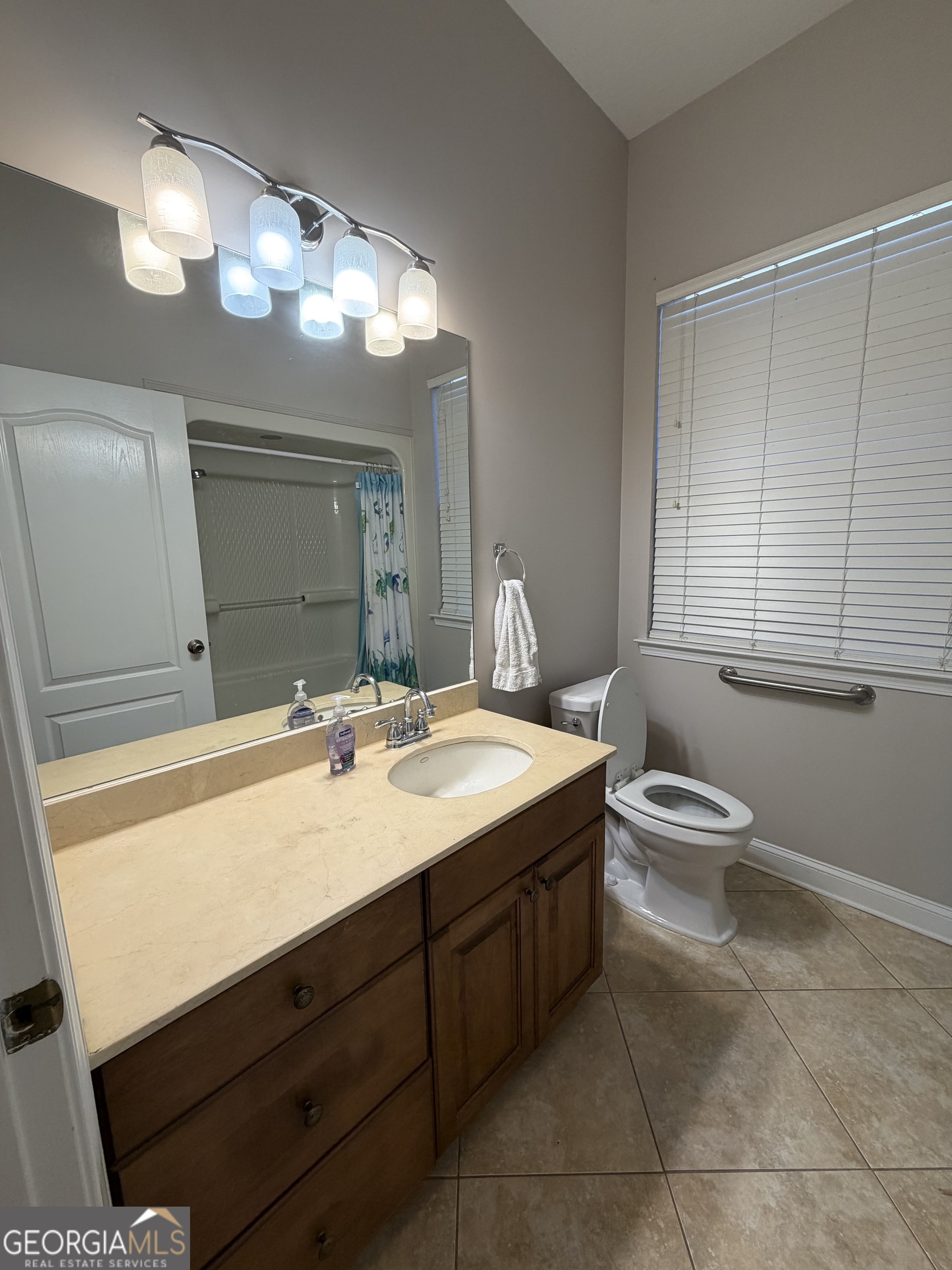 108 Heron's Nest Circle Kingsland, GA 31548 - Photo 47 of 62 a bathroom with a sink a toilet and mirror