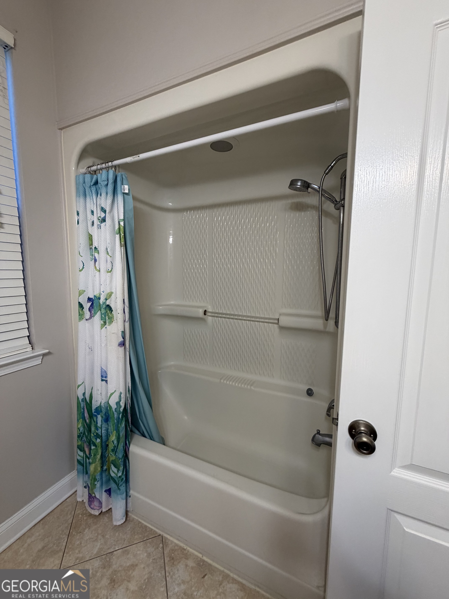108 Heron's Nest Circle Kingsland, GA 31548 - Photo 48 of 62 a bathroom with a bathtub and a shower