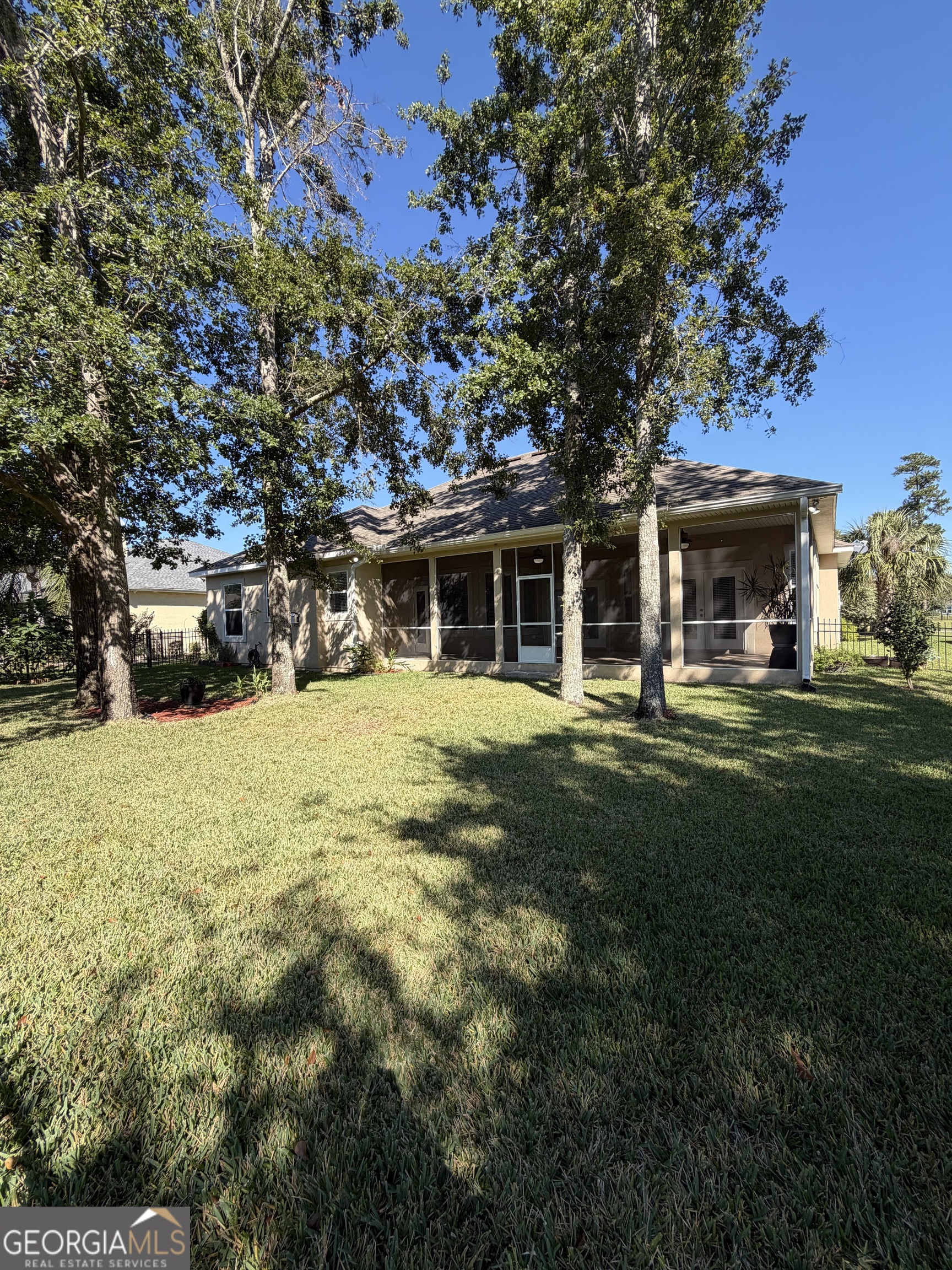 108 Heron's Nest Circle Kingsland, GA 31548 - Photo 57 of 62 a front view of house with yard and green space