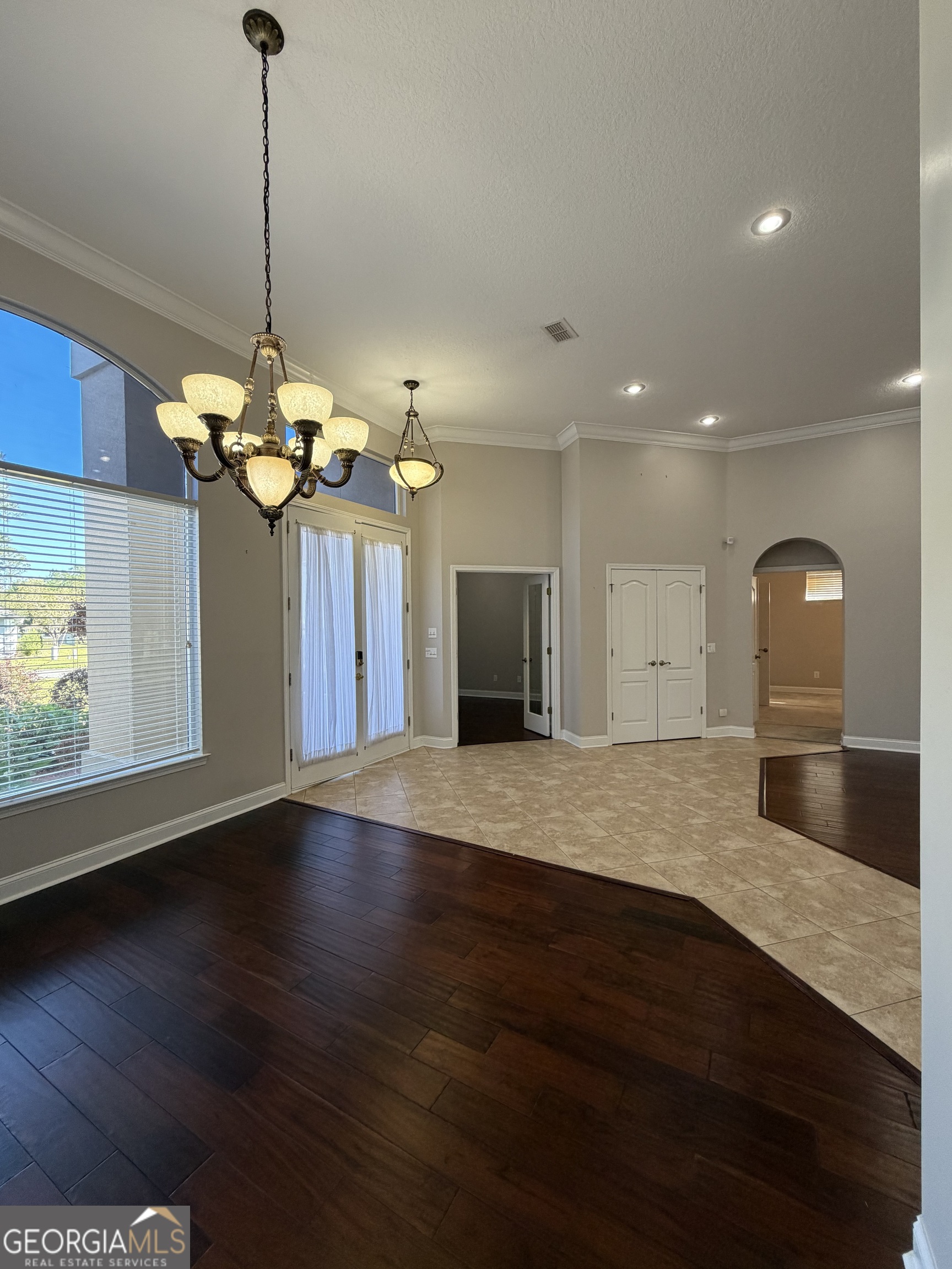 108 Heron's Nest Circle Kingsland, GA 31548 - Photo 6 of 62 a view of a room with a chandelier and wooden floor