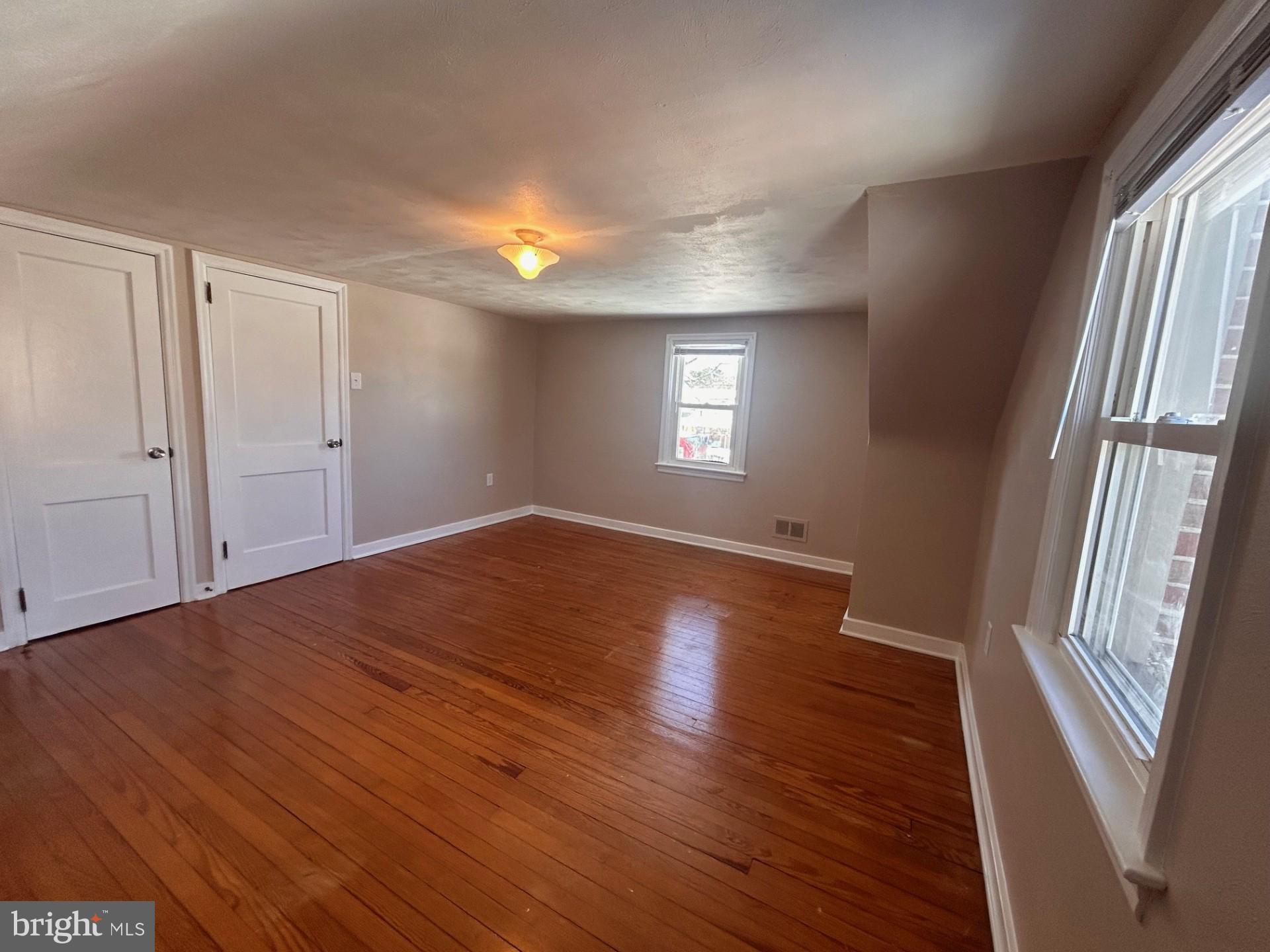 340 Edgewood Road York, PA 17402 - Photo 12 of 14 wooden floor in an empty room with a window