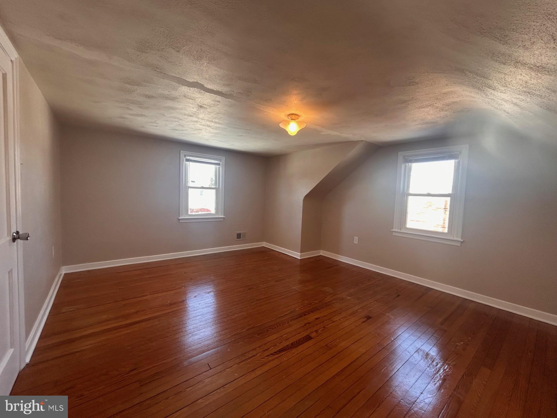 340 Edgewood Road York, PA 17402 - Photo 13 of 14 a view of empty room with wooden floor and fan