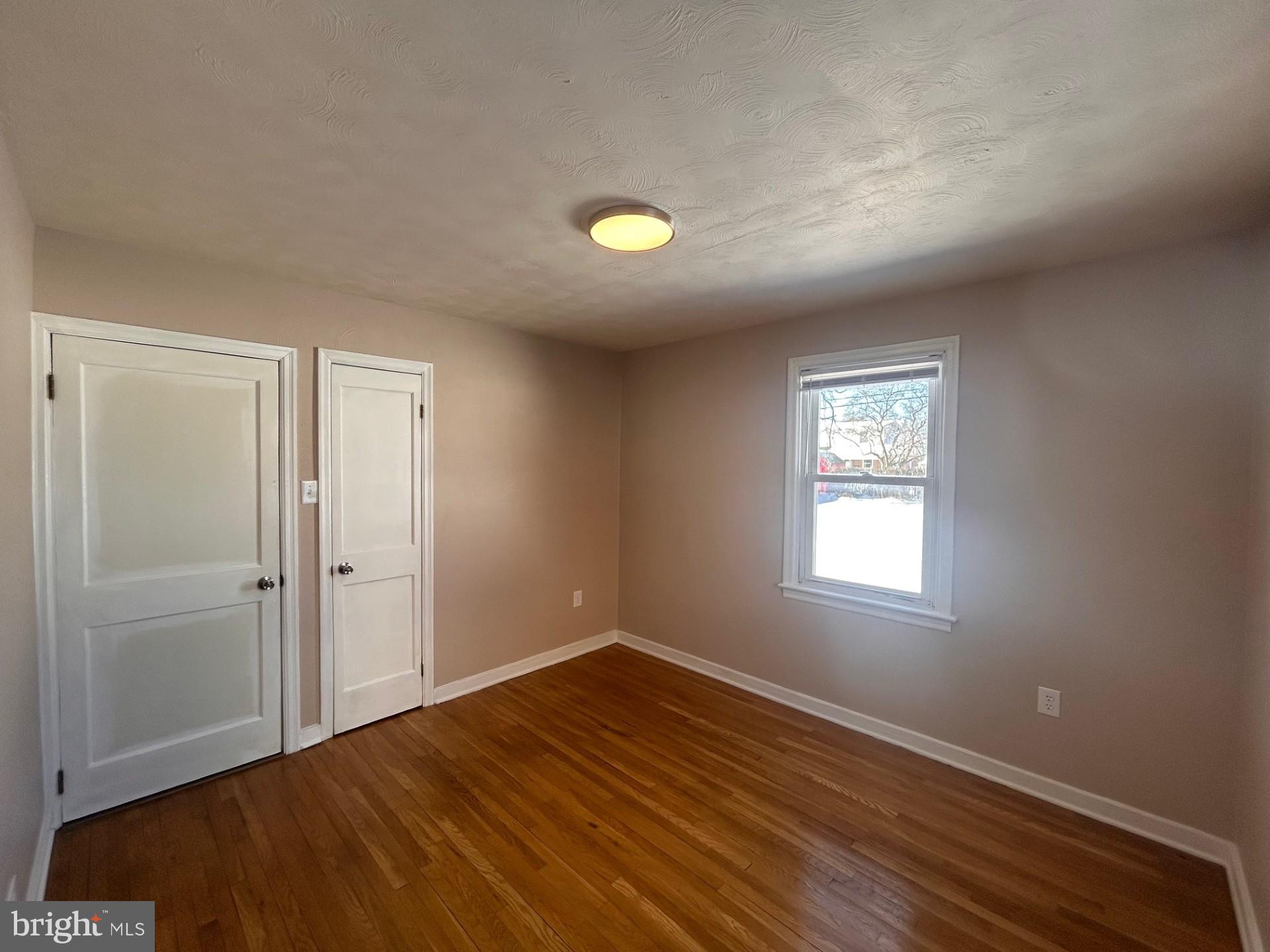 340 Edgewood Road York, PA 17402 - Photo 9 of 14 wooden floor in an empty room with a window