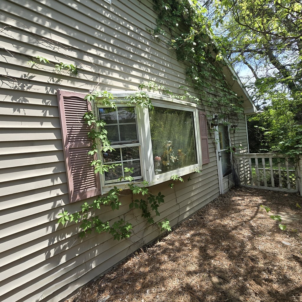 27282 Cheapside Road Cape Charles, VA 23310 - Photo 2 of 16 a view of a house with a garden