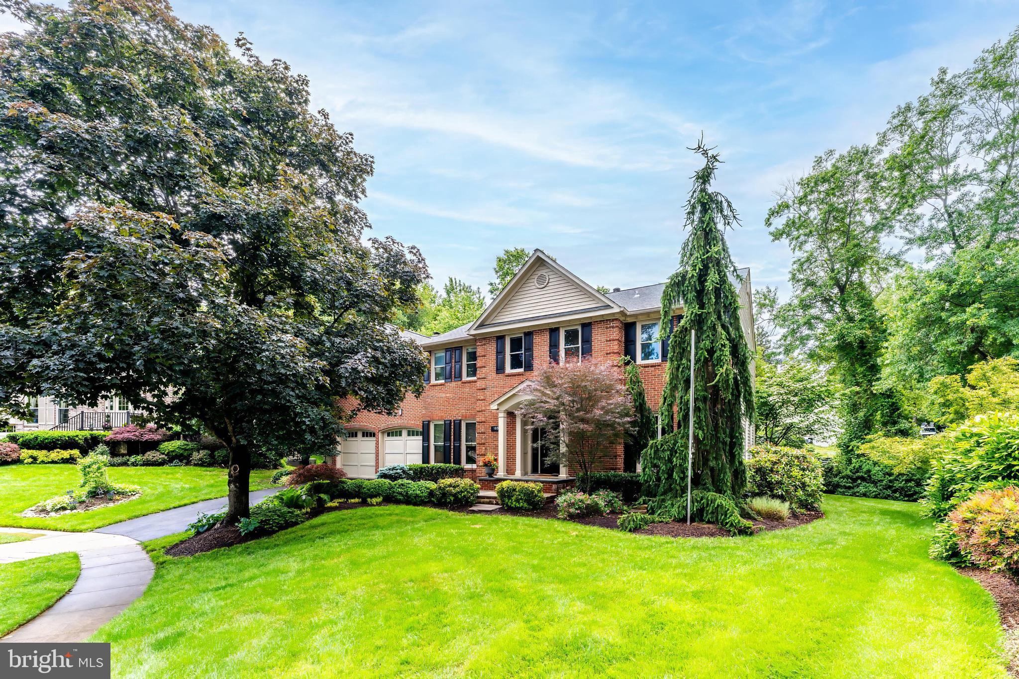 1655 Hunting Ridge Court McLean, VA 22101 - Photo 1 of 38 a front view of a house with a yard