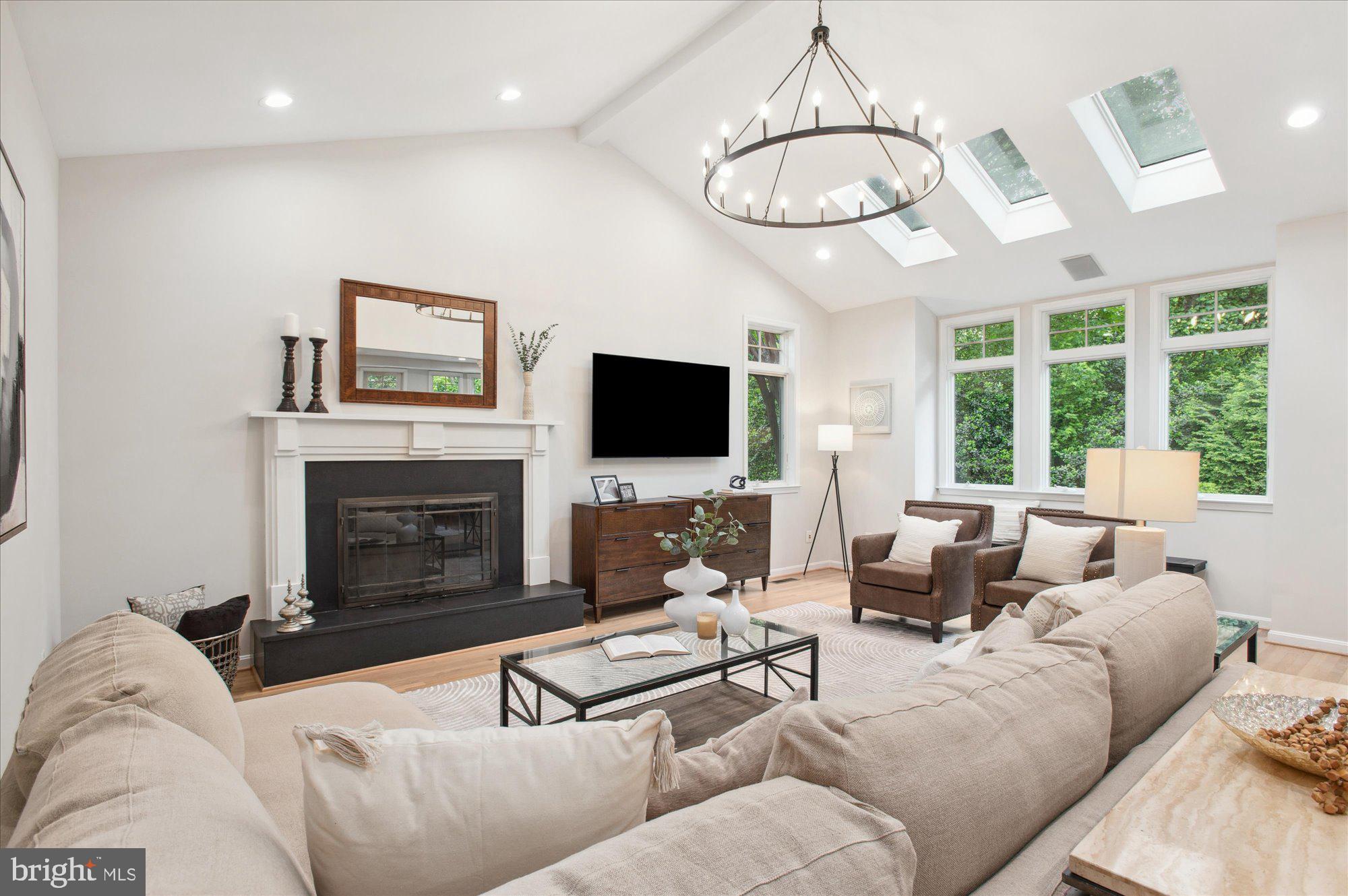 1655 Hunting Ridge Court McLean, VA 22101 - Photo 14 of 38 a living room with furniture fireplace and a flat screen tv
