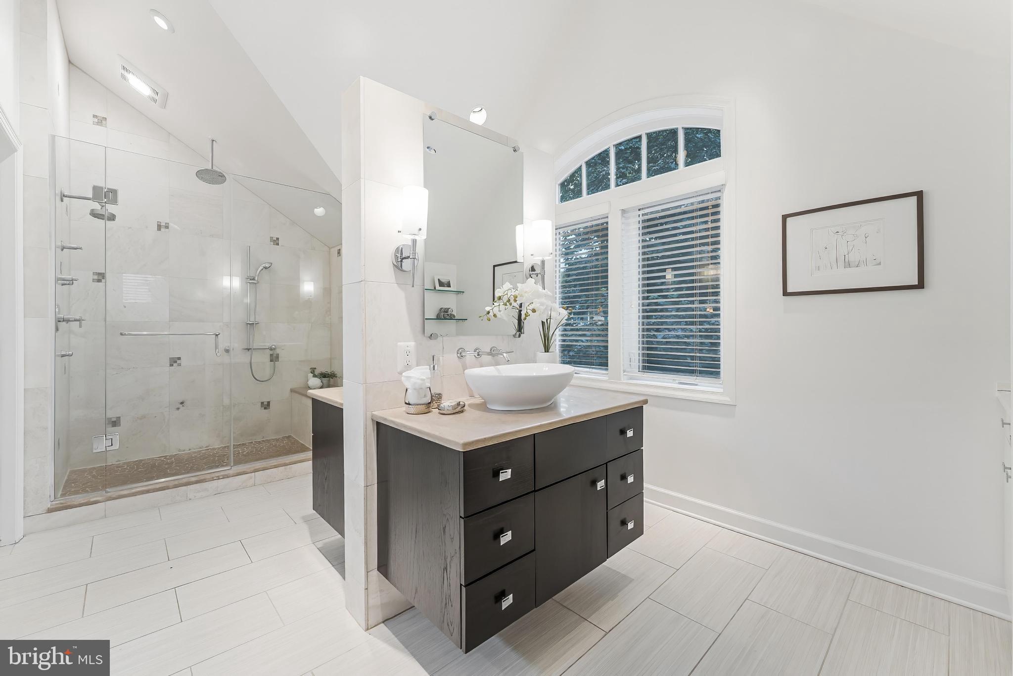 1655 Hunting Ridge Court McLean, VA 22101 - Photo 24 of 38 a bathroom with a sink a toilet a shower and a mirror