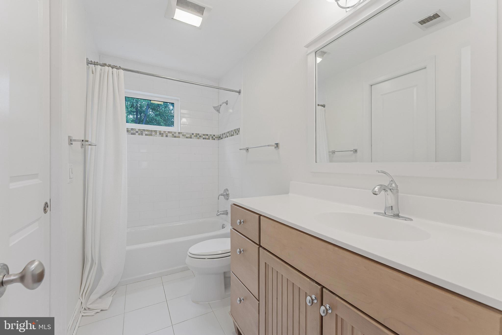 1655 Hunting Ridge Court McLean, VA 22101 - Photo 28 of 38 a bathroom with a sink a toilet and shower