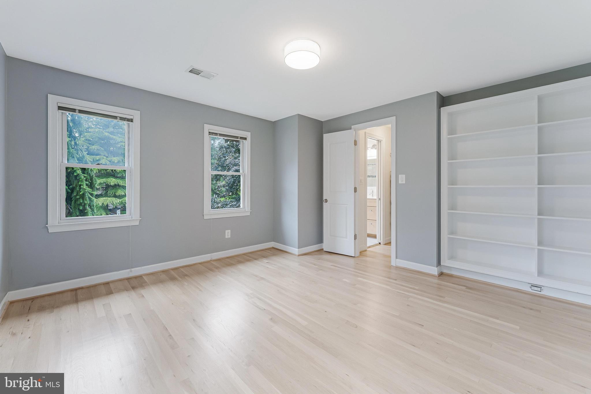 1655 Hunting Ridge Court McLean, VA 22101 - Photo 29 of 38 an empty room with window and wooden floor