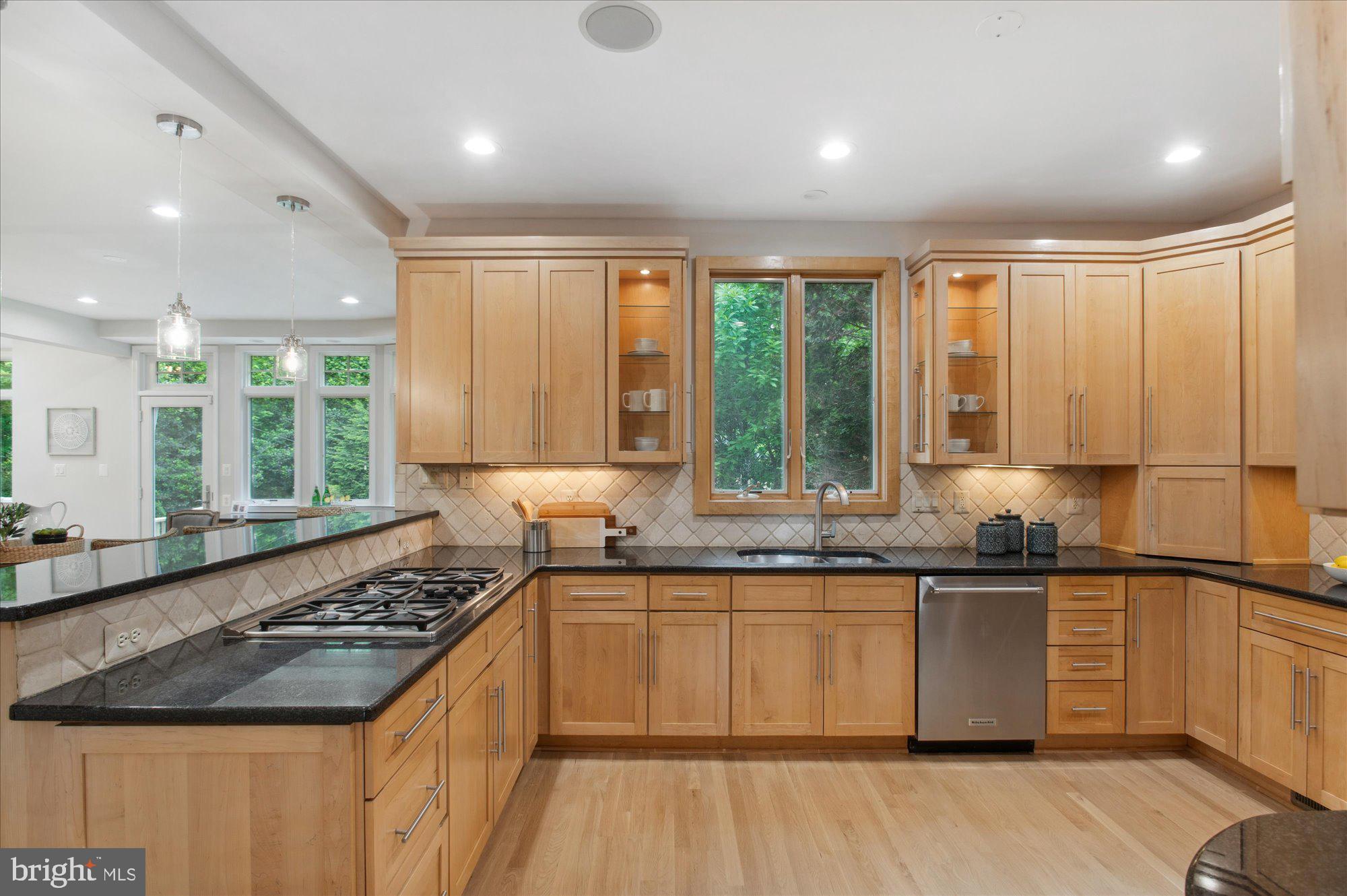 1655 Hunting Ridge Court McLean, VA 22101 - Photo 9 of 38 a kitchen with a sink stove and cabinets