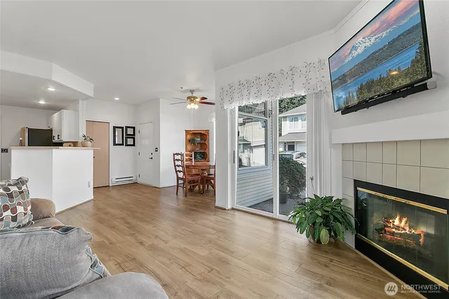 a living room with furniture and a fireplace