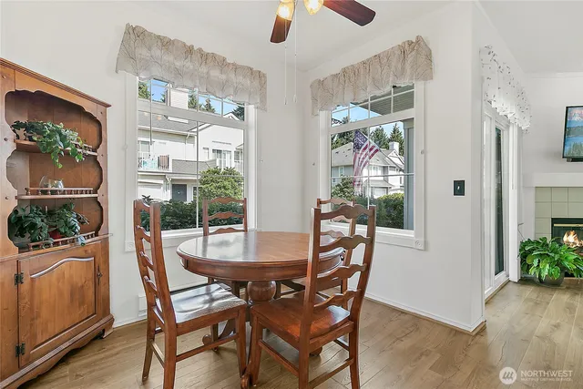 a dining room with furniture garden view and a chandelier