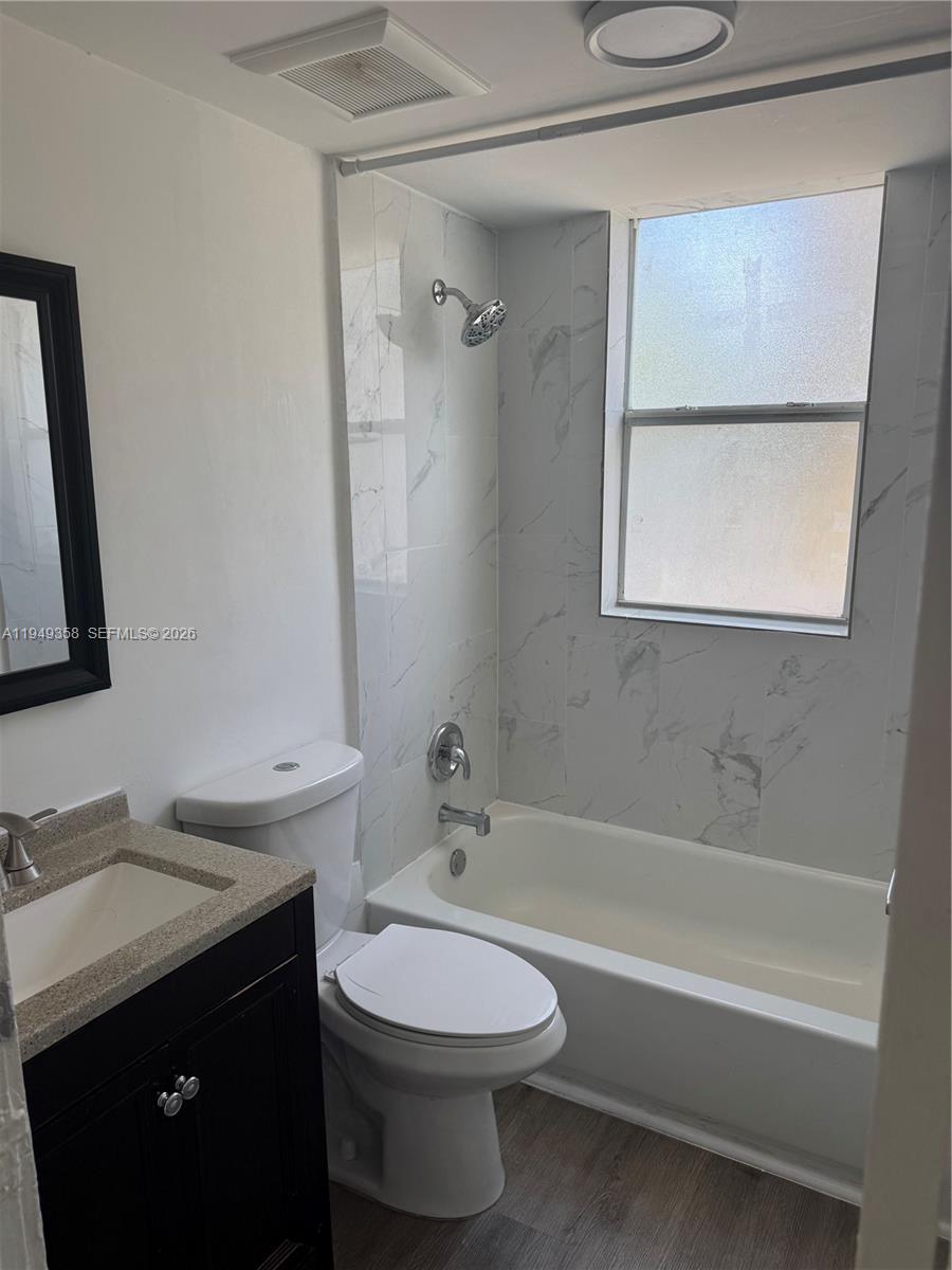 1552 Southwest 2nd Street, Unit 1 Miami, FL 33135 - Photo 11 of 11 a bathroom with a sink a toilet and a bathtub