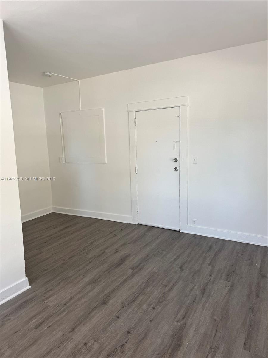 1552 Southwest 2nd Street, Unit 1 Miami, FL 33135 - Photo 2 of 11 a view of an empty room with wooden floor