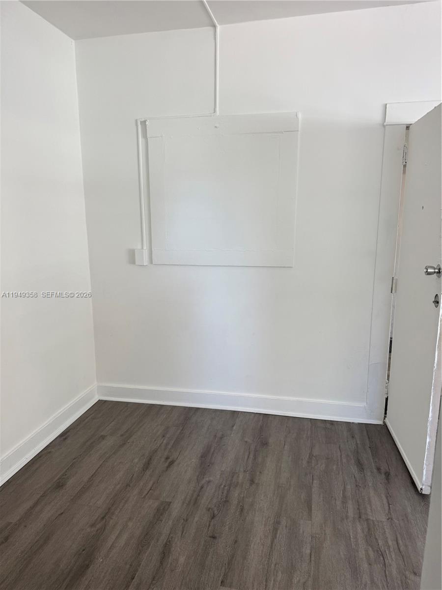 1552 Southwest 2nd Street, Unit 1 Miami, FL 33135 - Photo 6 of 11 a view of a room with wooden floor