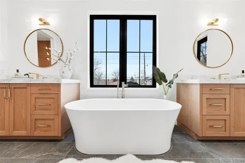 a white bath tub sitting next to a window