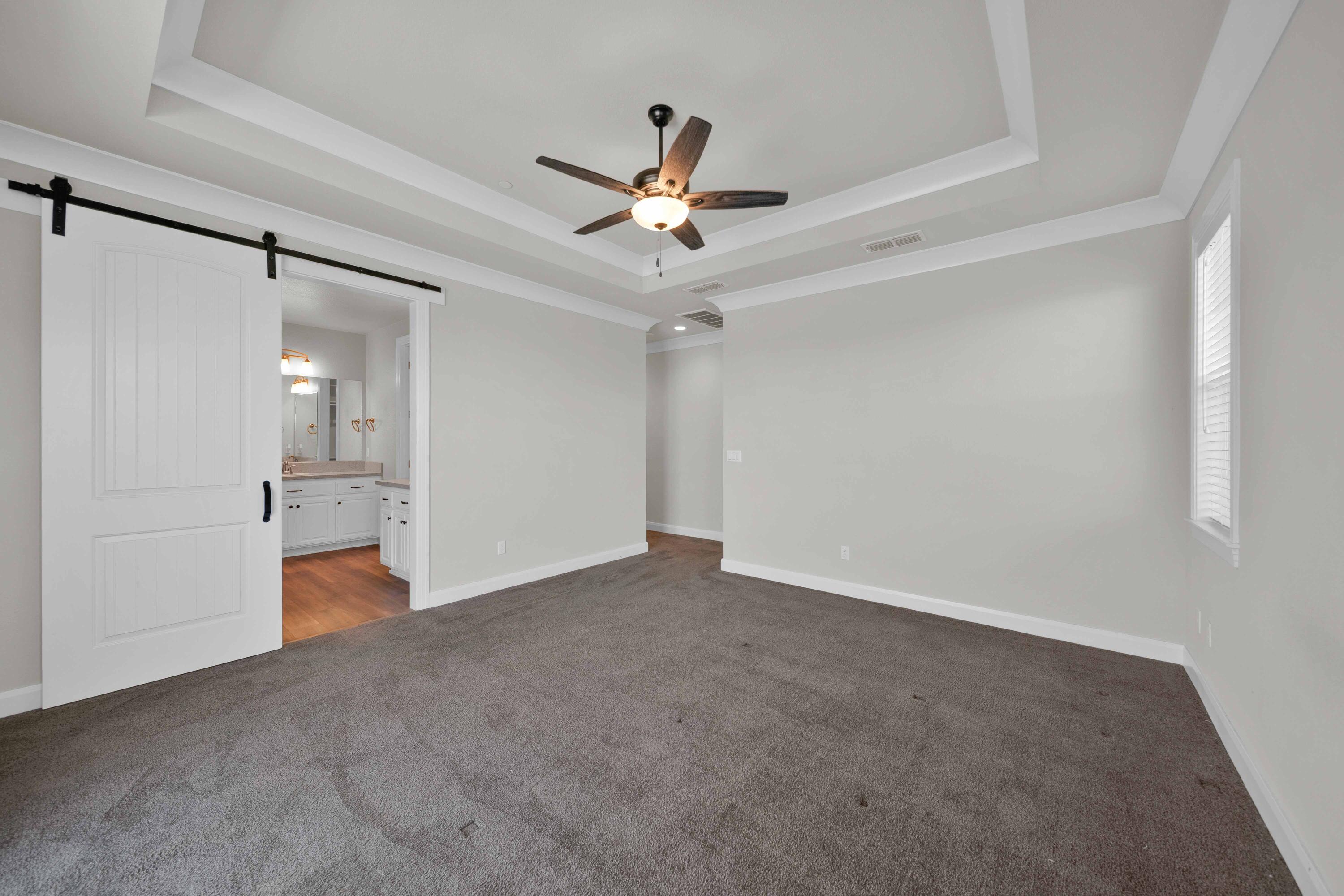 4771 Lower Springs Road Redding, CA 96001 - Photo 14 of 30 a view of an empty room with a ceiling fan