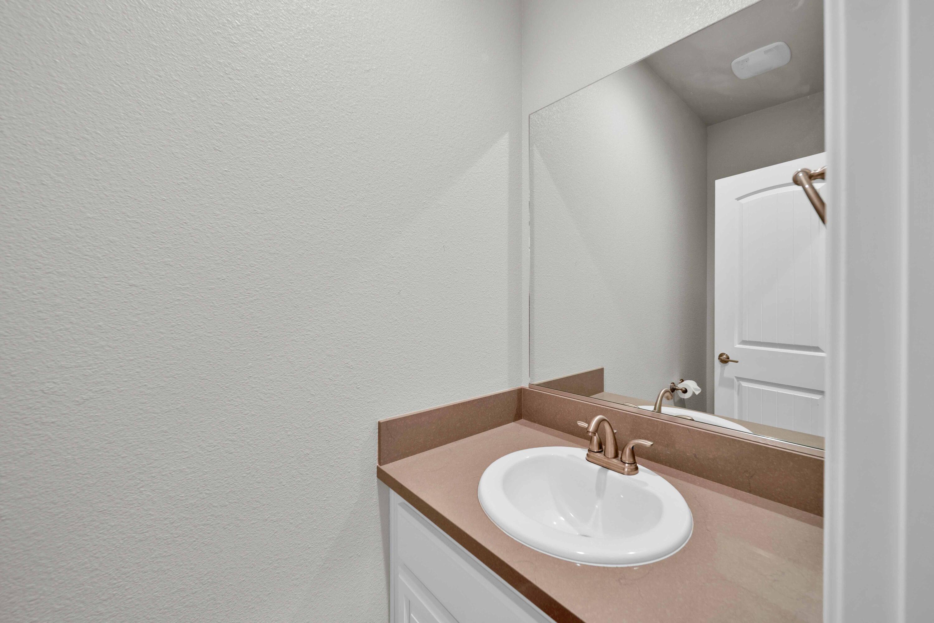 4771 Lower Springs Road Redding, CA 96001 - Photo 24 of 30 a bathroom with a sink and a mirror