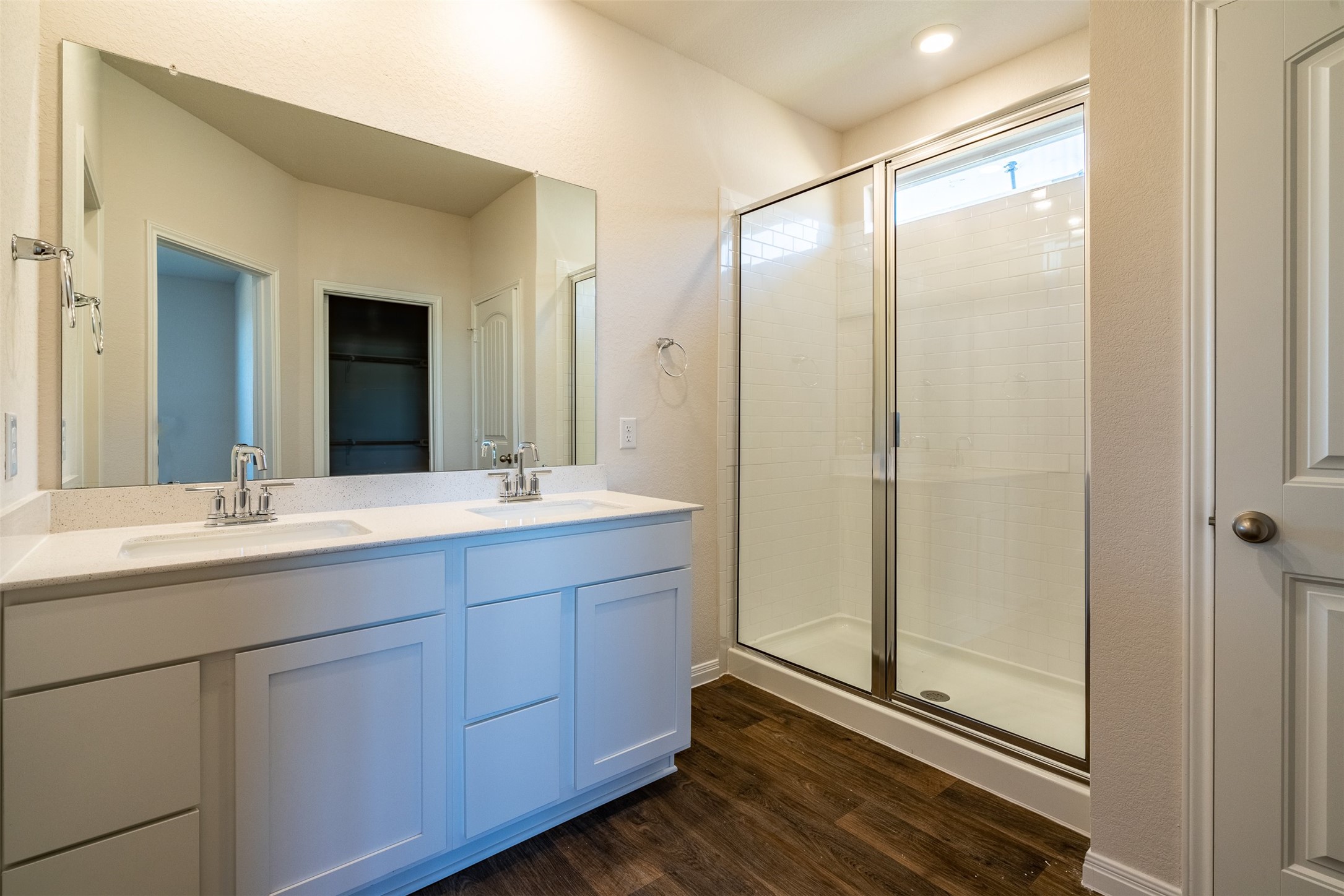 233 Brooklyn Drive Georgetown, TX 78626 - Photo 12 of 21 a bathroom with a double vanity sink and mirror