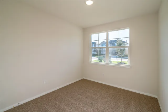a view of an empty room and window