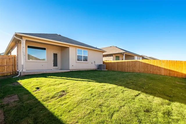 front view of a house with a big yard