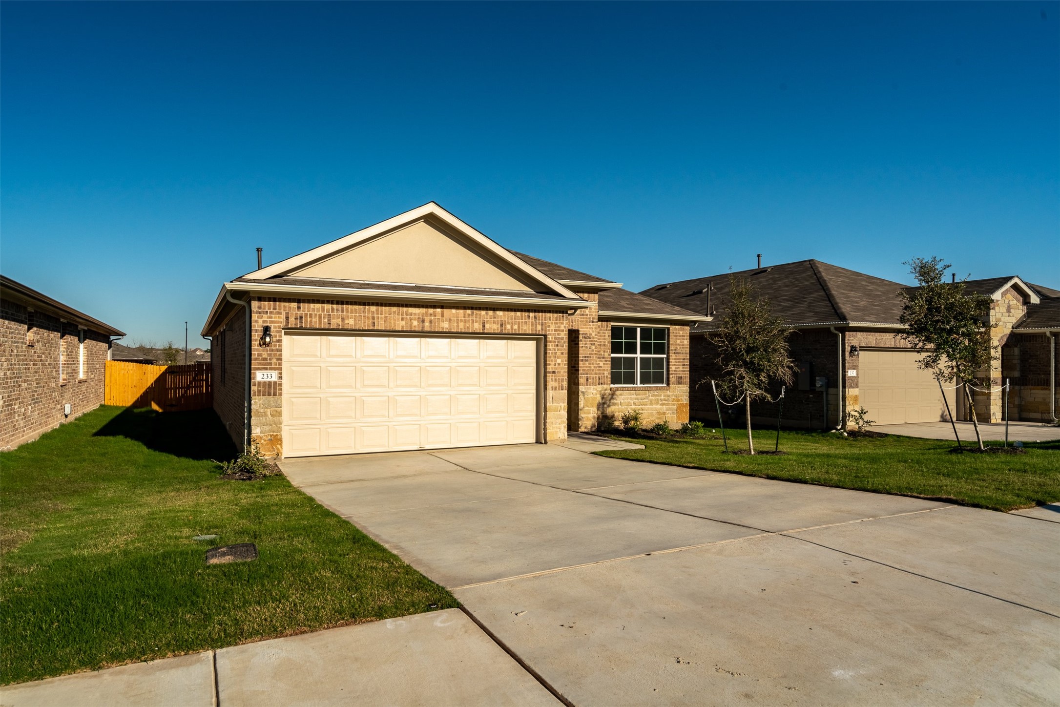 233 Brooklyn Drive Georgetown, TX 78626 - Photo 2 of 21 a front view of a house with a yard and garage