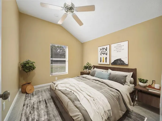 a bedroom with a bed and a window