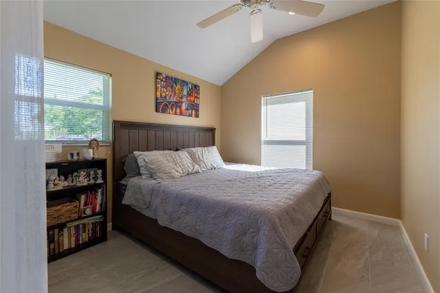 a bedroom with a bed and a book shelf