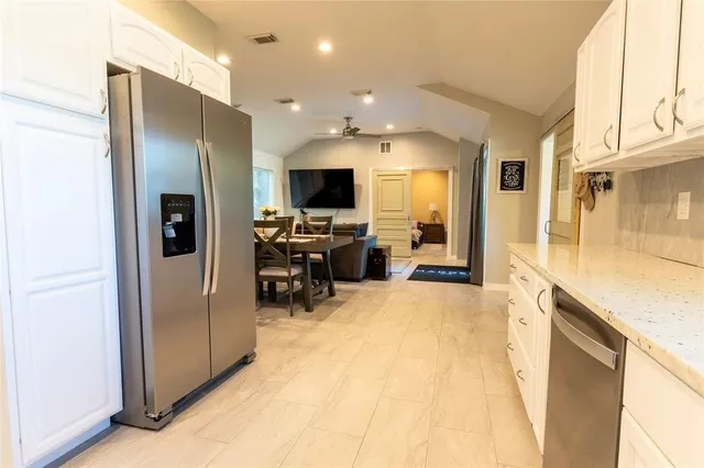 a view of a living room with a flat screen tv
