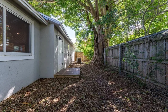 a backyard of a house with lots of green space