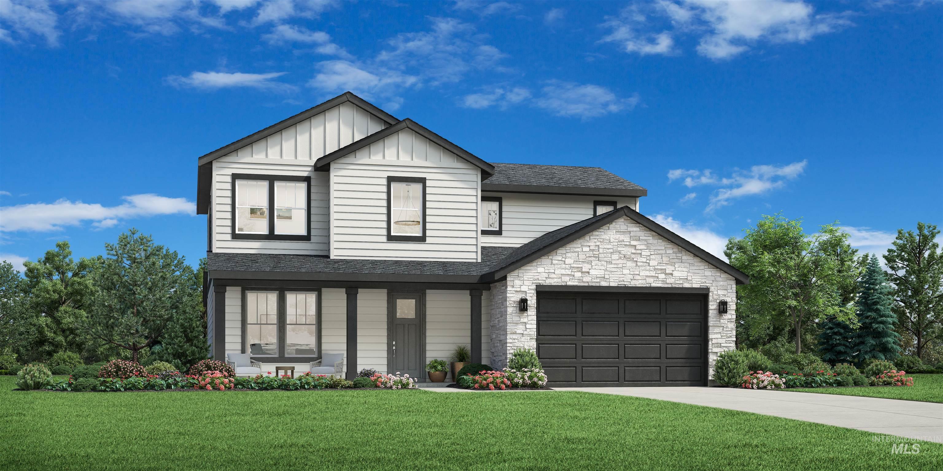 View of front facade featuring a front lawn, stone siding, board and batten siding, a shingled roof, and concrete driveway