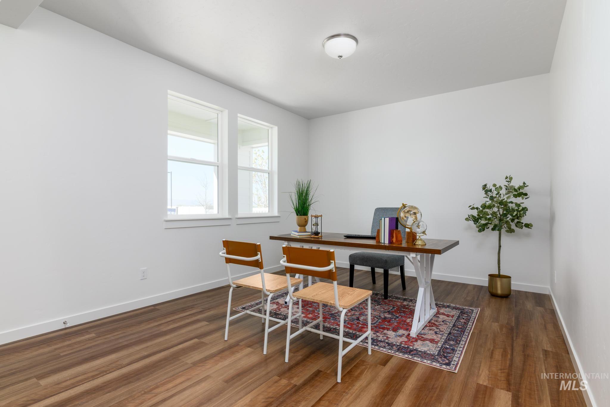 6049 West Snow Currant Street Meridian, ID 83646 - Photo 6 of 12 Office with dark wood-style flooring and baseboards