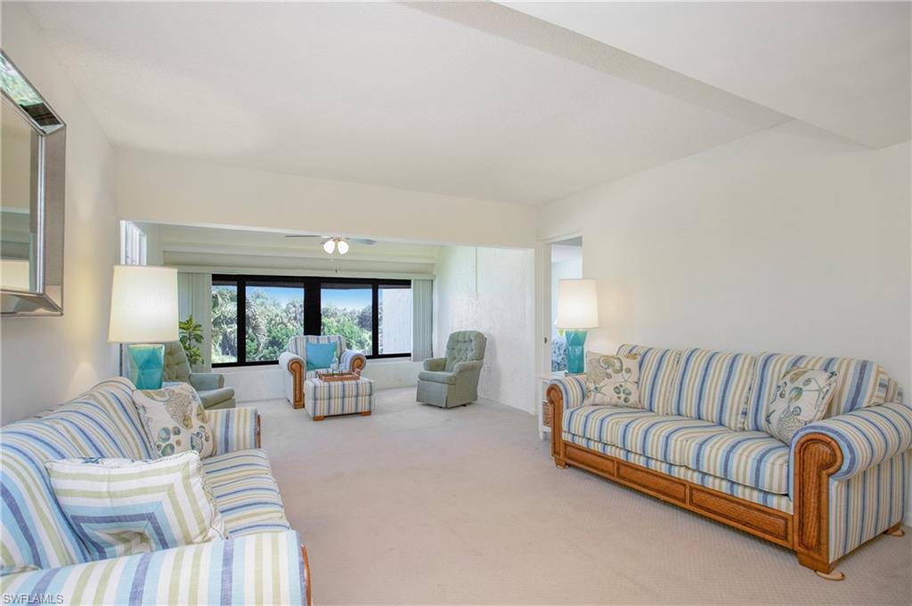 955 Palm View Drive, Unit B307 Naples, FL 34110 - Photo 9 of 25 a living room with furniture