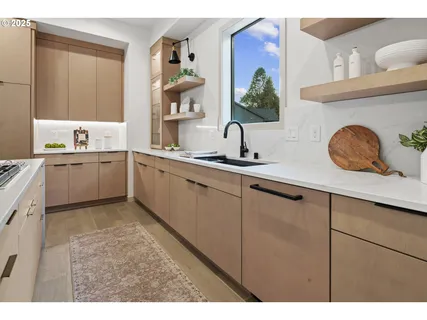 a kitchen with a sink and cabinets