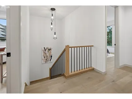 a view of a hallway with stairs