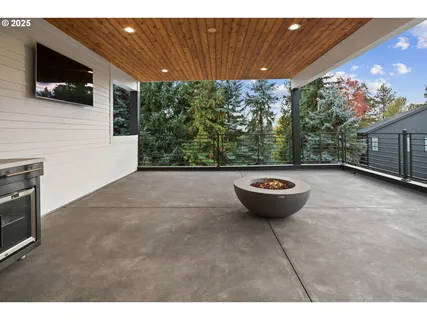 a view of a outdoor space with a patio and fire pit