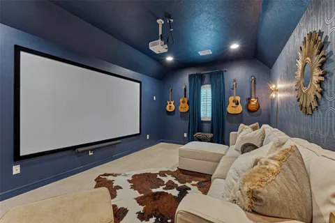 a view of a hallway to a livingroom with furniture