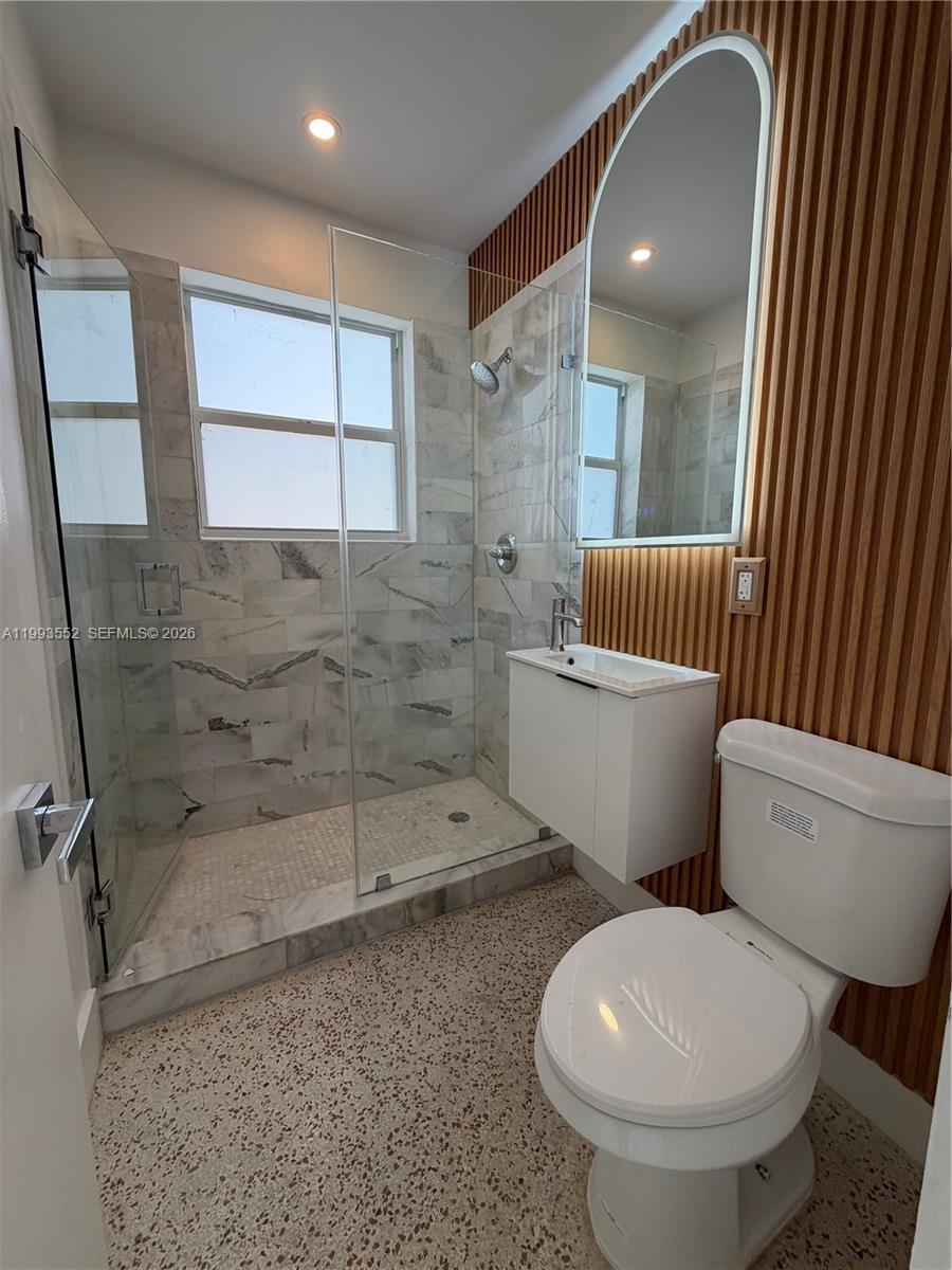 2784 Southwest 31st Place Miami, FL 33133 - Photo 11 of 16 a white toilet sitting next to a bathroom sink