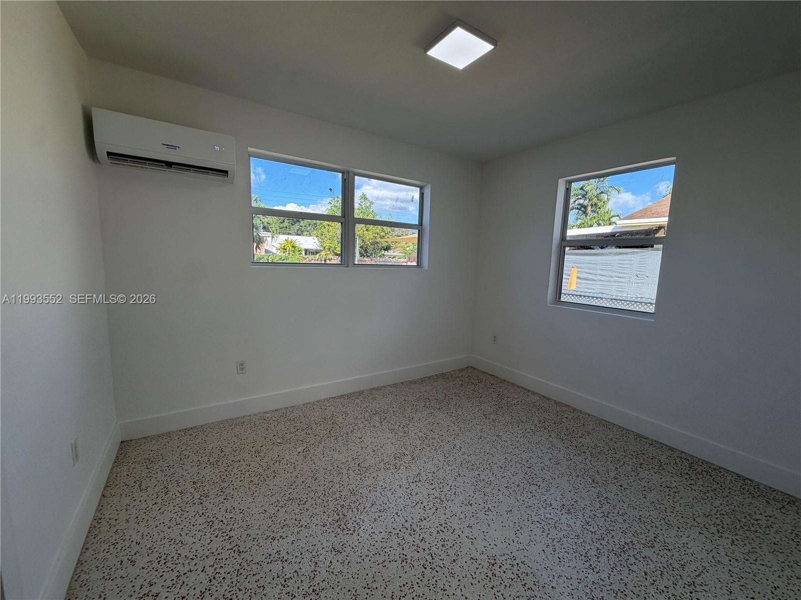 2784 Southwest 31st Place Miami, FL 33133 - Photo 12 of 16 an empty room with windows