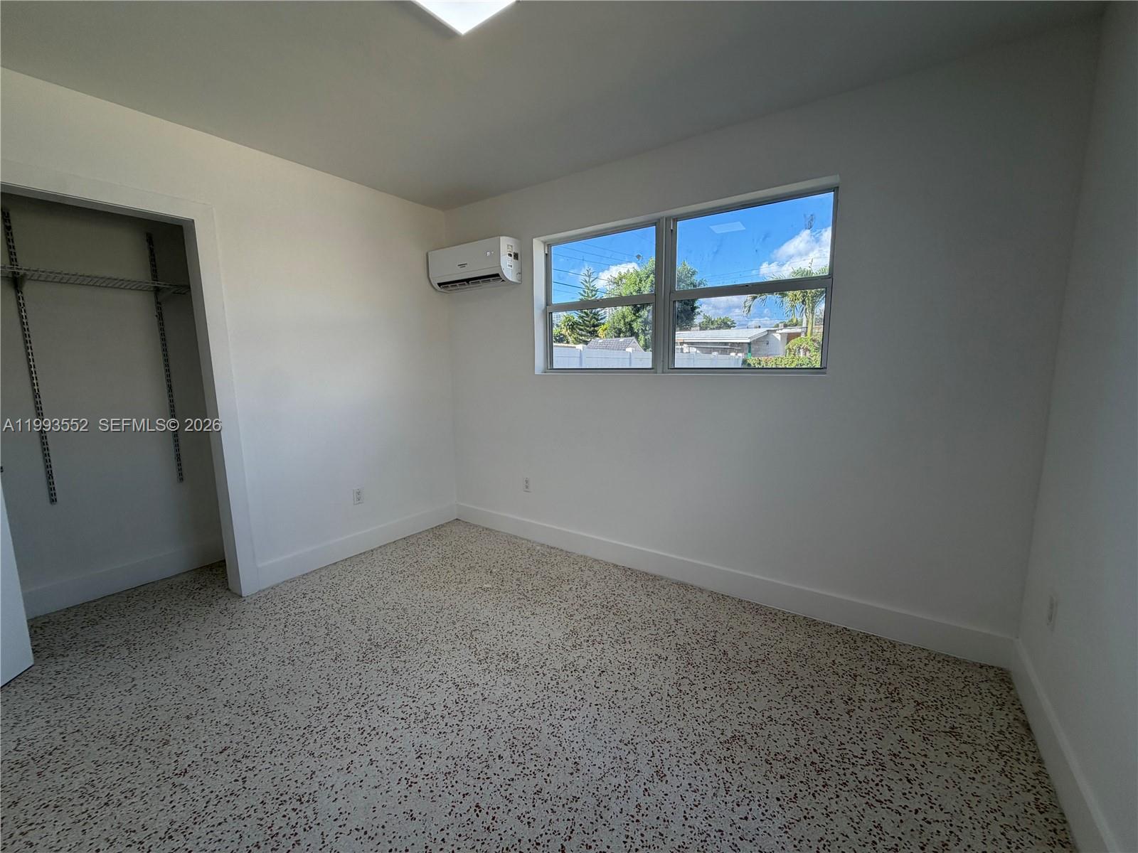 2784 Southwest 31st Place Miami, FL 33133 - Photo 13 of 16 an empty room with a window