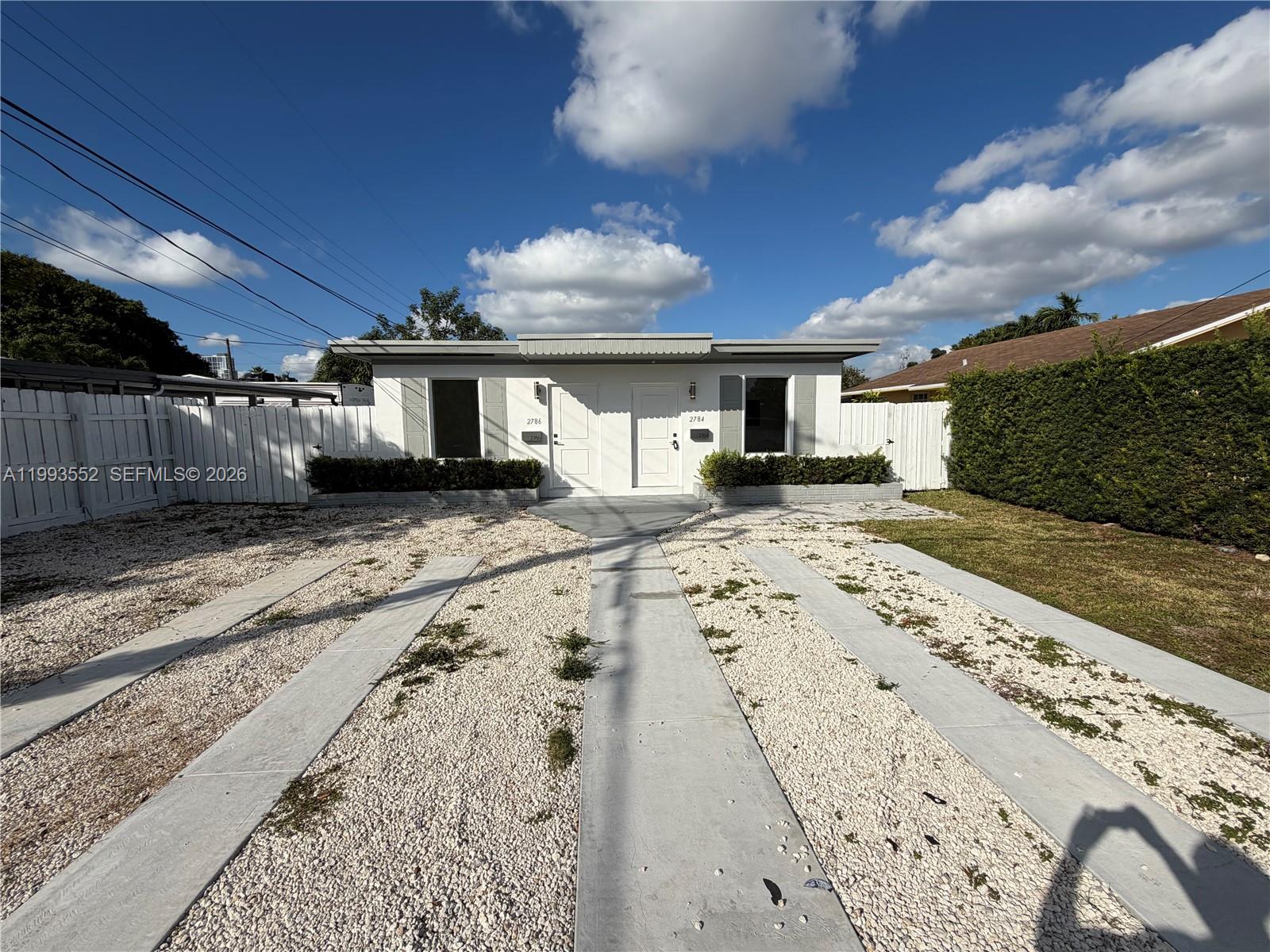 2784 Southwest 31st Place Miami, FL 33133 - Photo 2 of 16 a view of a house with a snow in the yard