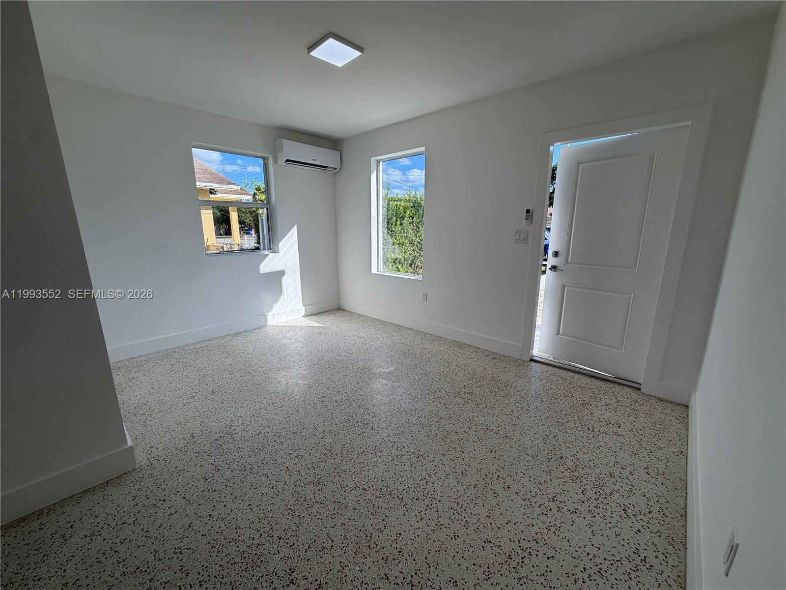 2784 Southwest 31st Place Miami, FL 33133 - Photo 5 of 16 an empty room with windows and cabinet