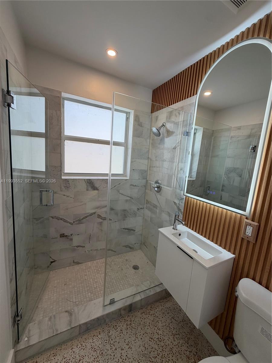 2784 Southwest 31st Place Miami, FL 33133 - Photo 10 of 16 a bathroom with a bathtub and a shower