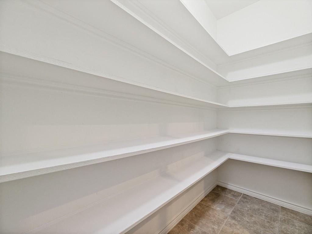 10032 Bell Rock Road Frisco, TX 75035 - Photo 12 of 23 Spacious pantry with shelving.
