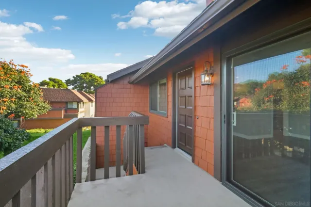a view of a house with a small yard