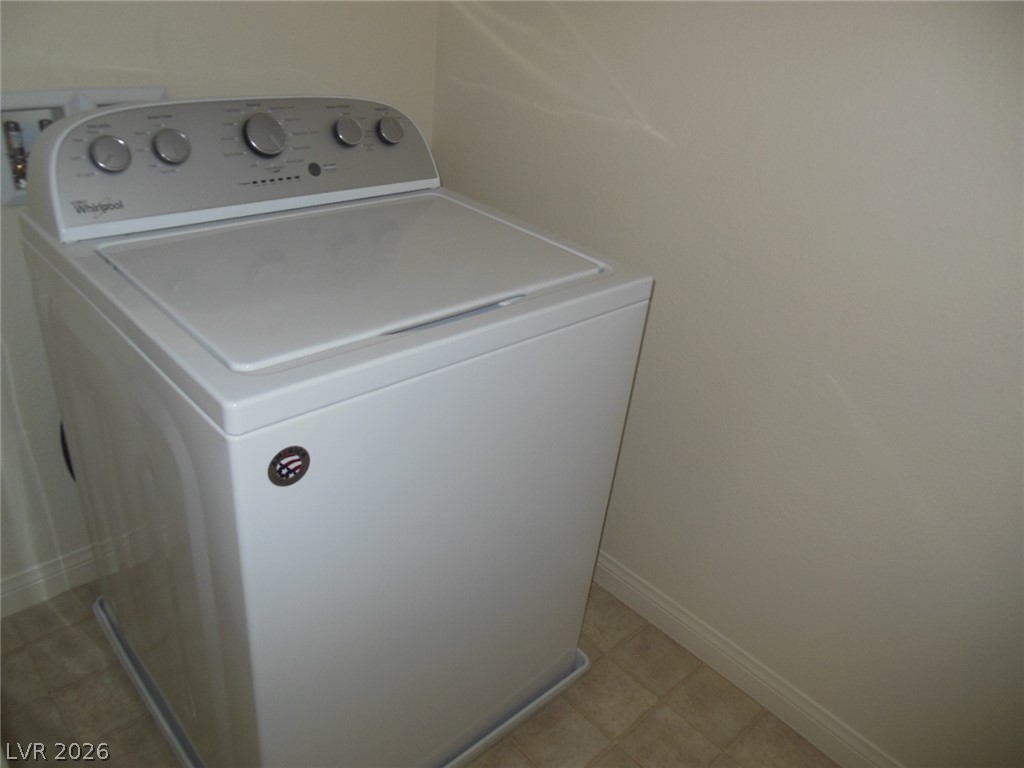 6390 Jackson Spring Road Las Vegas, NV 89118 - Photo 11 of 27 Efficient laundry solutions await in this well-appointed utility space.