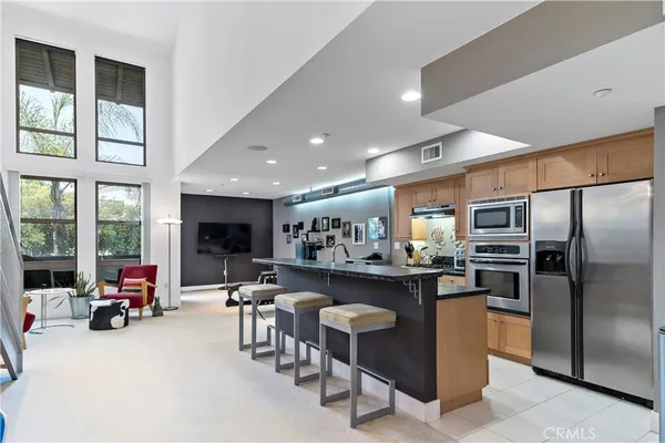 a kitchen with a sink cabinets and stainless steel appliances