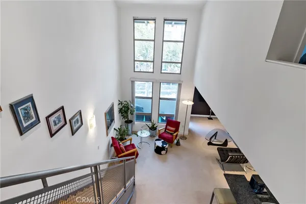 a view of a livingroom with furniture and air hockey table