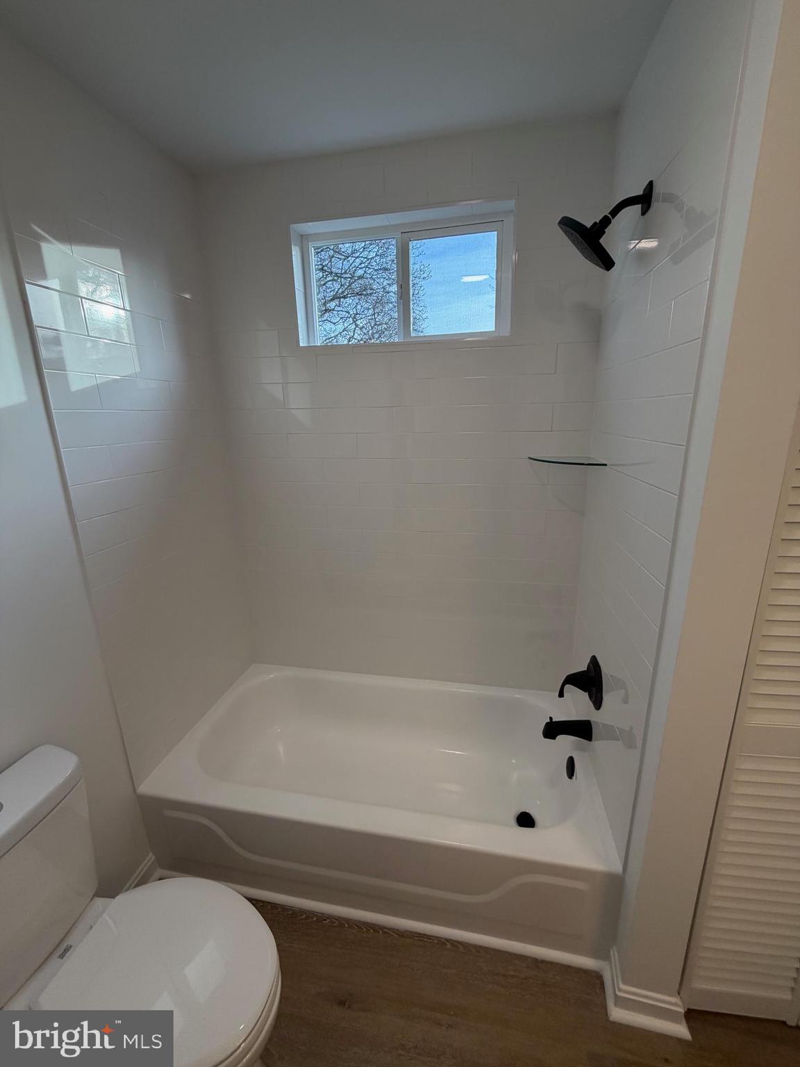 972 South Little Creek Road Dover, DE 19901 - Photo 15 of 22 a bathroom with a toilet and a tub